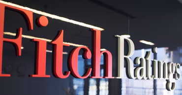 The Fitch Ratings logo displayed on a wall.