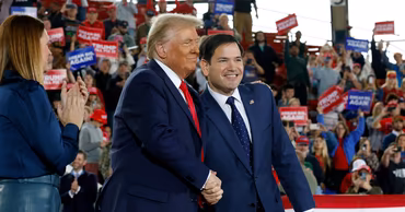 Marco Rubio shaking hands with Donald Trump at a political rally.