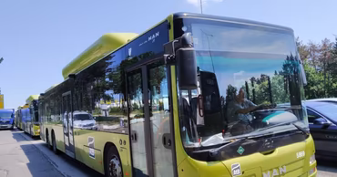 A green MAN city bus operated by the Chisinau municipal transport company.