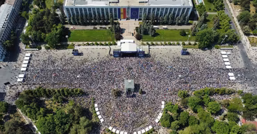 Aerial view of a large crowd gathered on the Great National Assembly Square in Chisinau, Moldova.