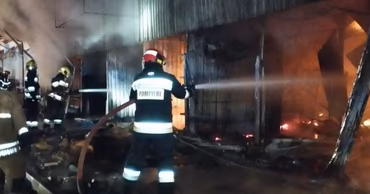 Moldovan firefighters extinguishing a fire at a building near the Central Market in Chisinau.