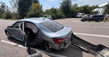 A damaged silver Skoda car on the road after a traffic accident.