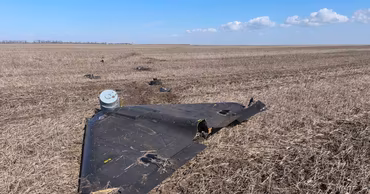 Wreckage of a Shahed drone lying in a field in Moldova.