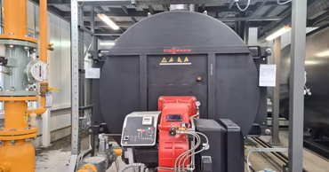 Industrial heating boiler in a technical facility.