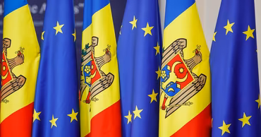 Flags of Moldova and the European Union displayed side by side.