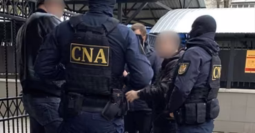CNA officers in tactical gear conducting an operation in Moldova.