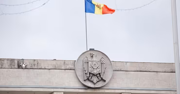 The Moldovan flag flying above the government building in Chisinau.