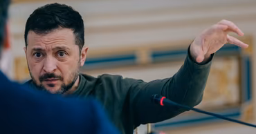 Volodymyr Zelenskyy speaking during a meeting or press conference.