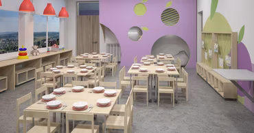 A modern, empty kindergarten dining room with tables set for children.