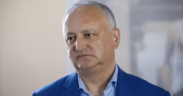 A portrait of Moldovan politician Igor Dodon wearing a blue jacket.