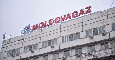 The headquarters building of the Moldovagaz company in Chisinau with its logo on the roof.
