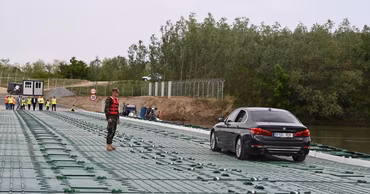 A car crossing the pontoon bridge at the Leova-Bumbata border crossing point.