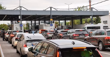 Cars waiting in line at a Moldovan border crossing point.
