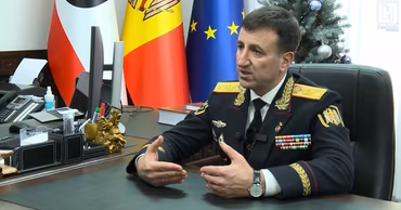 Viorel Cernăuțeanu, head of the Moldovan General Police Inspectorate, sitting at his desk.