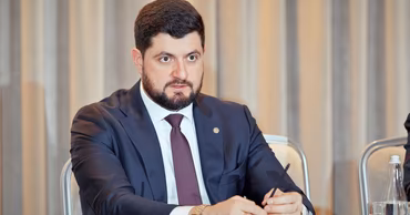 Victor Parlicov, Minister of Energy of Moldova, attending an official meeting or seminar.