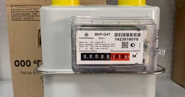 A close-up of a residential gas meter device.