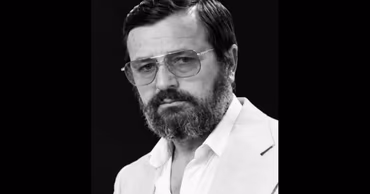 A black and white portrait of the Moldovan actor Veaceslav Madan.
