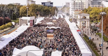 Aerial view of the National Wine Day festival in Chisinau with many visitors and white tents.