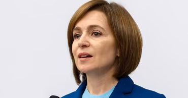Maia Sandu speaking at a podium.