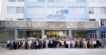 A large group of people standing in front of the National Agency for Public Health building in Moldova.
