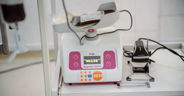Medical blood collection and processing equipment with a UNFPA logo in a hospital setting.