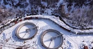 Aerial view of the water intake facility in Cosauti covered in snow.
