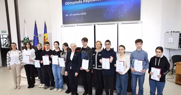 Students and officials at a Moldovan chemistry olympiad award ceremony.