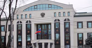 The building of the Russian Embassy in Chisinau, Moldova, with the Russian flag visible.