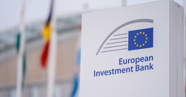 The logo of the European Investment Bank on a sign outside a building.