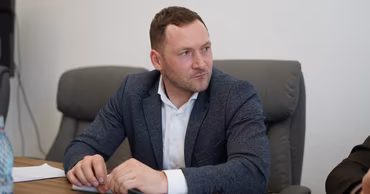 Sergiu Lazarencu, Minister of Environment of Moldova, sitting at a table during a meeting.